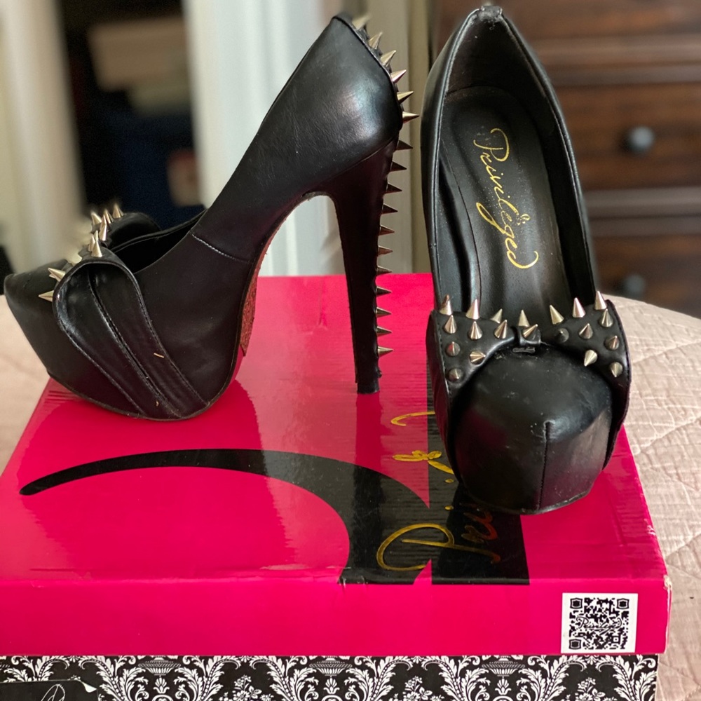 Studded black pumps